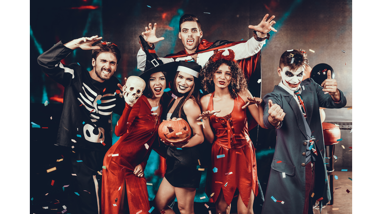 Portrait of Young Smiling People in Scary Costumes