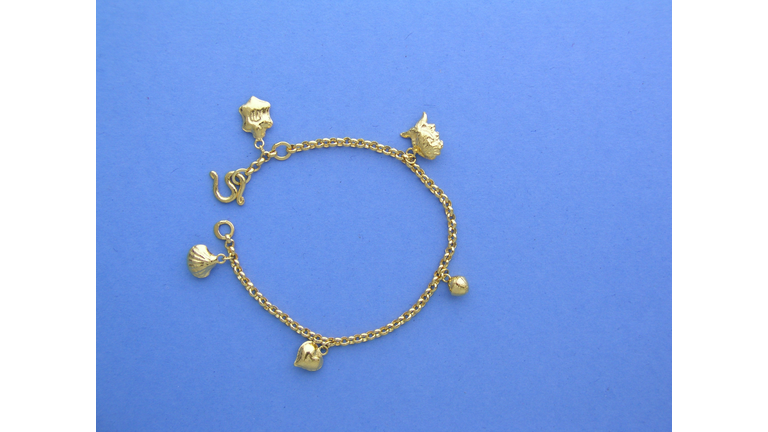 Gold charm bracelet for baby