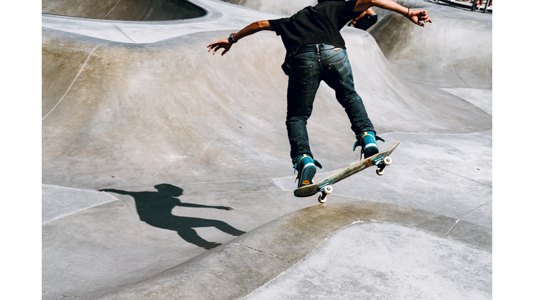 Man Skateboarding At Park