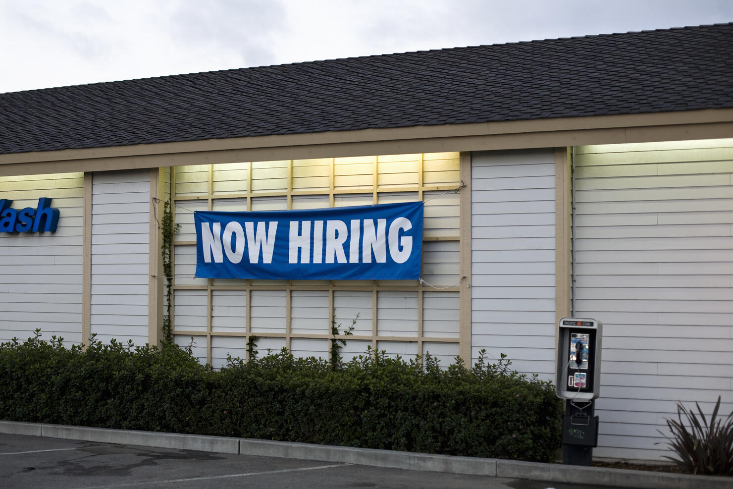 A NOW HIRING sign