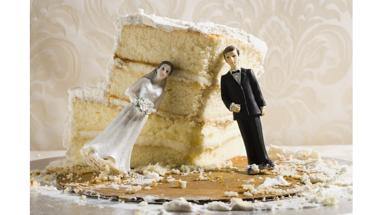 Wedding cake visual metaphor with figurine cake toppers