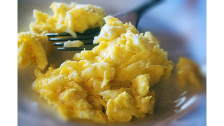 Close-up of a plate of fluffy scrambled eggs