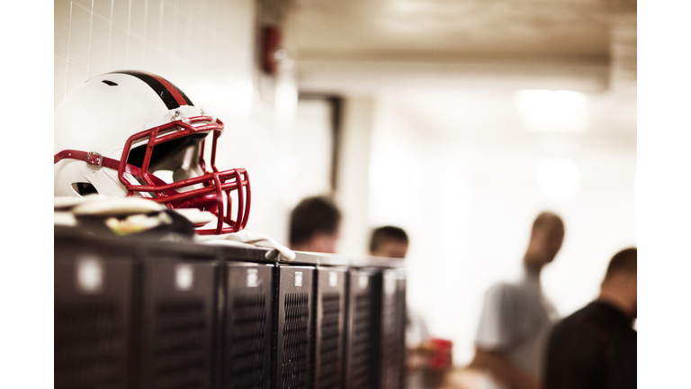 Sports helmet on table in illuminated room