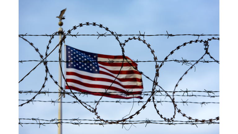 American flag and barbed wire, USA border