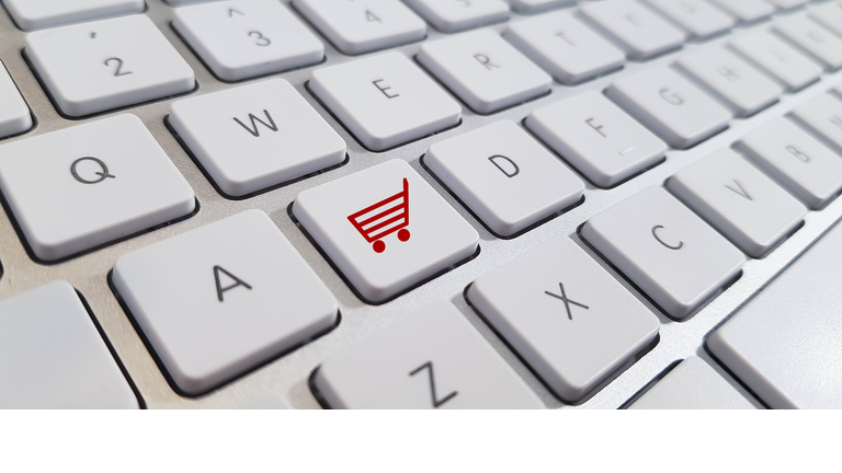 Online Shopping Icon on White Wireless Keyboard