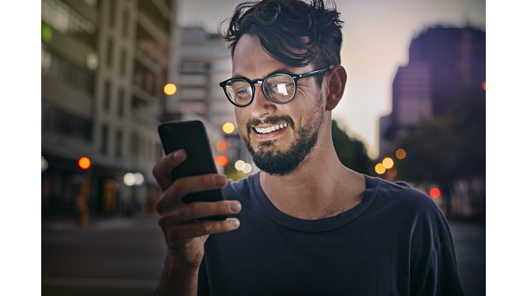 Young man reading text message