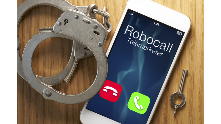 Telemarketer robocall scam: legislation for smartphone with gavel