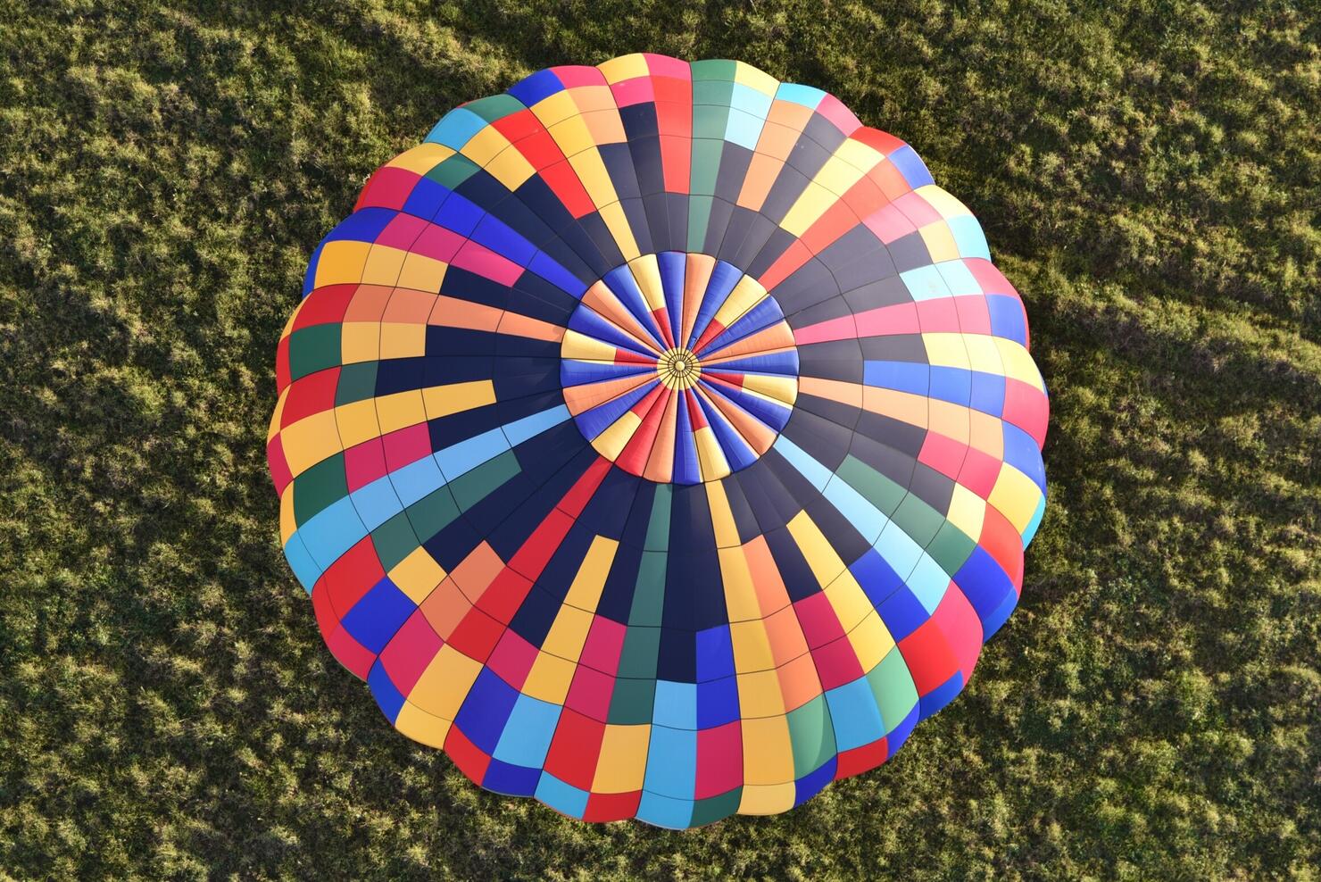 High Angle View Of Colorful Hot Air Balloon Over Landscape