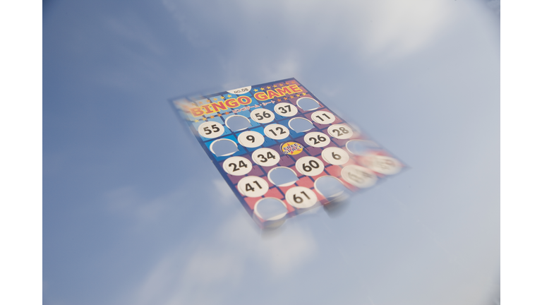 Bingo card floating in cloudy sky