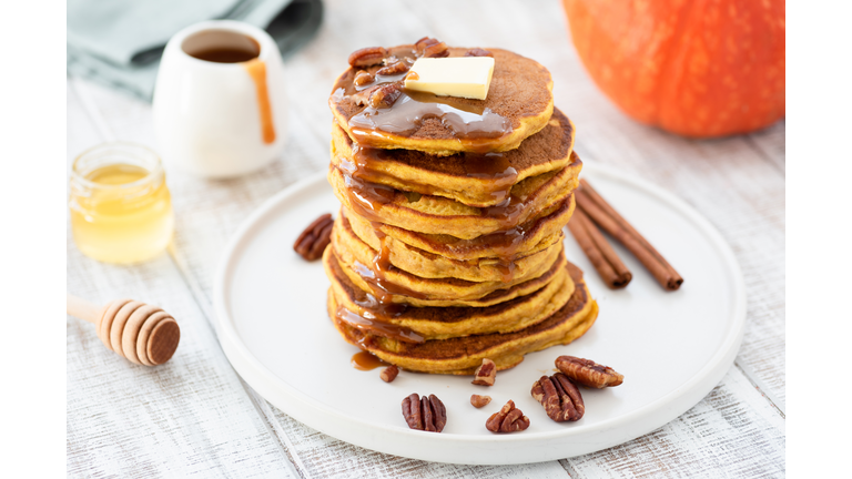 Pumpkin spice pancakes stack on white plate