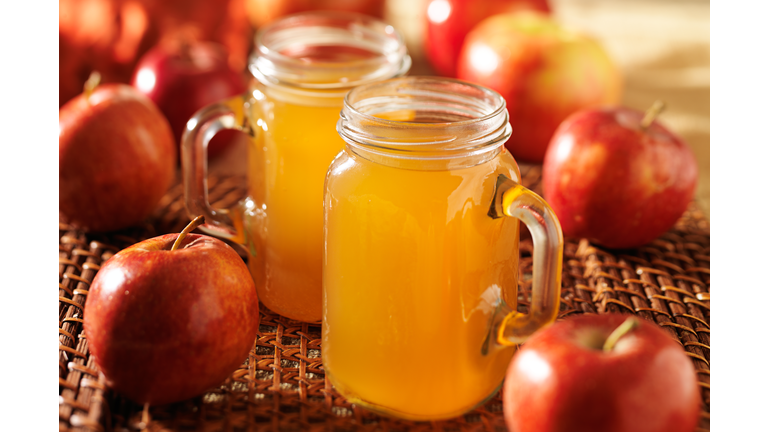 mason jars filled with hot apple cider horizontal photo