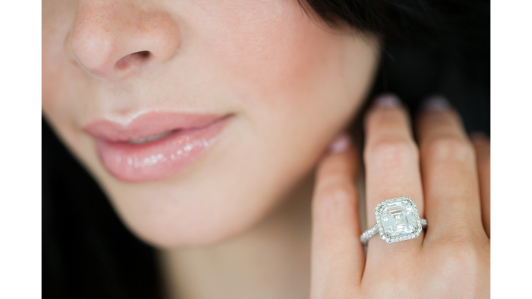 Young woman wearing engagement ring