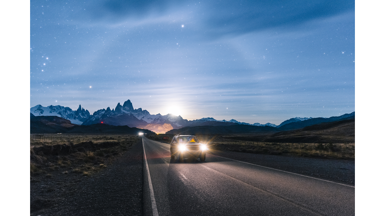 Car driving at night on the road to El Chalten, Patagonia Argentina