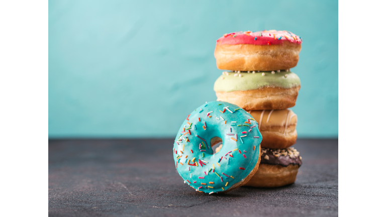 Stack of assorted donuts, copy space