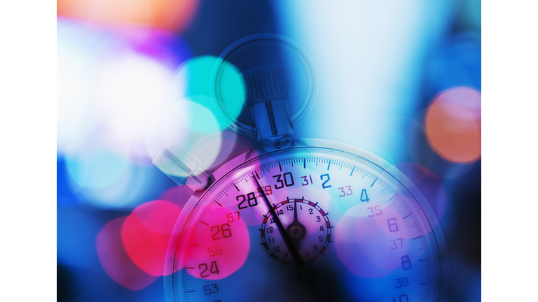 USA, New York, New York City, Stopwatch and colorful lights