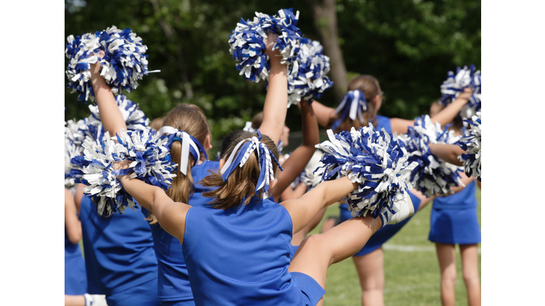 Cheerleaders Cheering at Football Game