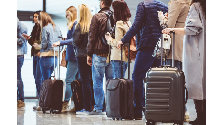 Group of people in queue at boarding gate