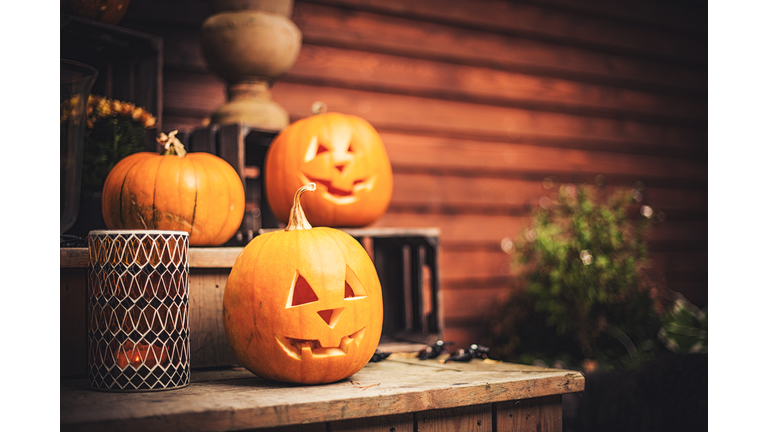 Pumpkins on front step with halloween decorations