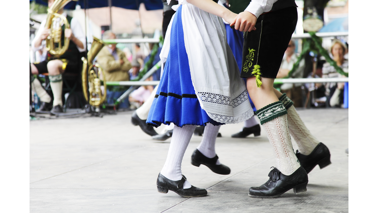 bavarian couple dancing at oktoberfest