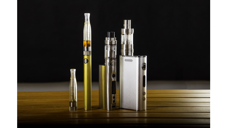 vape devices and electronic cigarette, ecig and mods over a black background.