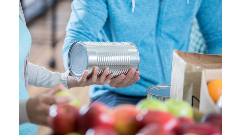 Food bank volunteer organize food donations