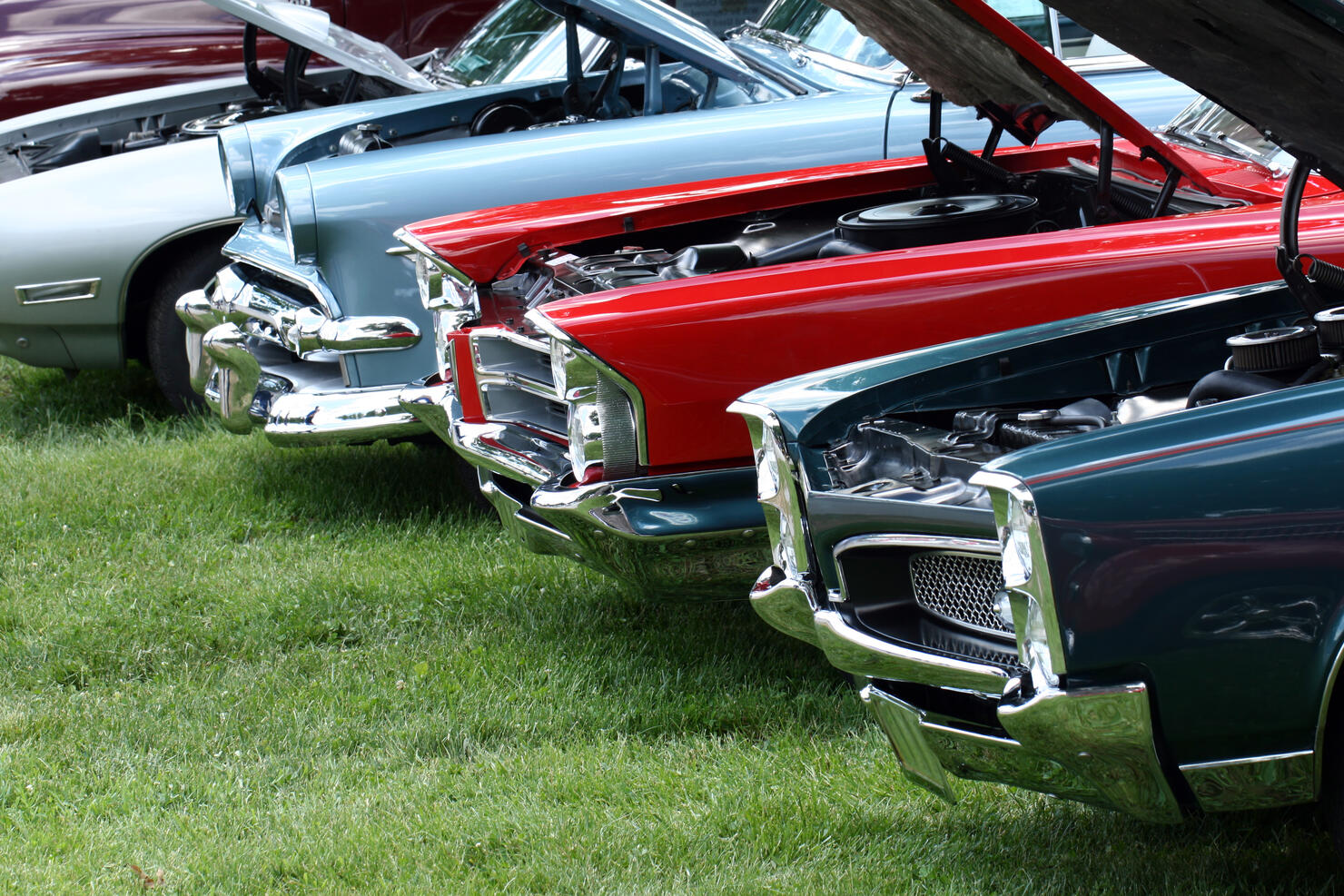 Display of classic automobiles at Indiana car show.  Colorful.  Summer.