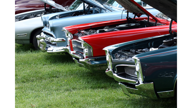 Display of classic automobiles at Indiana car show.  Colorful.  Summer.