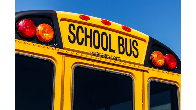 Yellow School Bus in a District Lot Waiting to Depart for Students VI