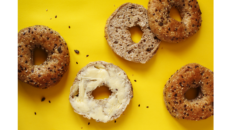Closeup of a 12 grain bagel with butter