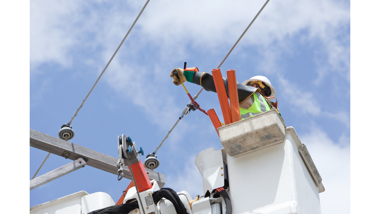 Electric Utility Lineman Cuts Jumper Wire Connection