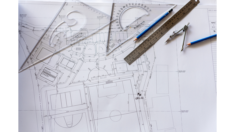 Close-up of Architect engineer drawing plan on blueprint with architect equipment