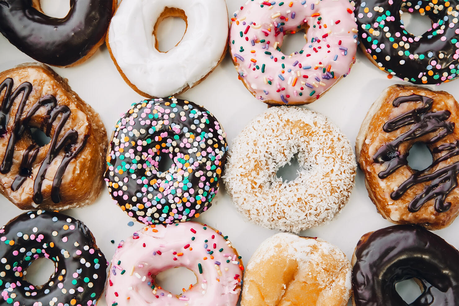 donuts in multicolored glaze and sprinkling