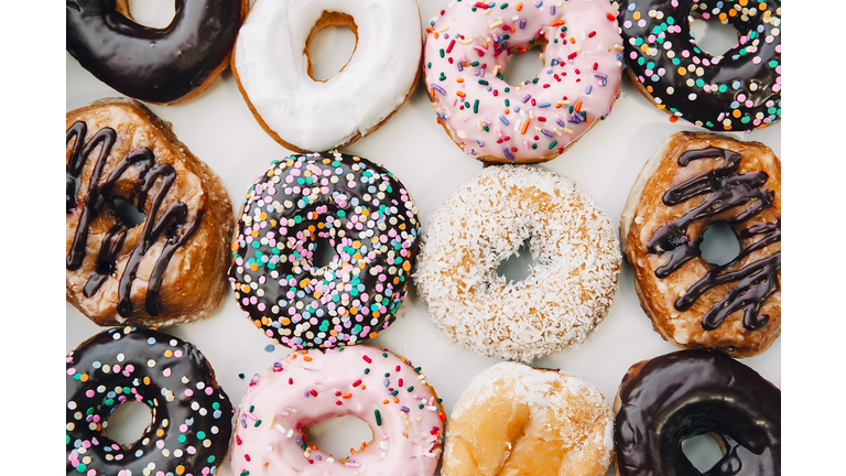 donuts in multicolored glaze and sprinkling