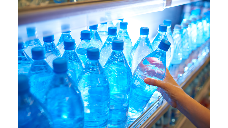 Bottled water on shelf in supermarket