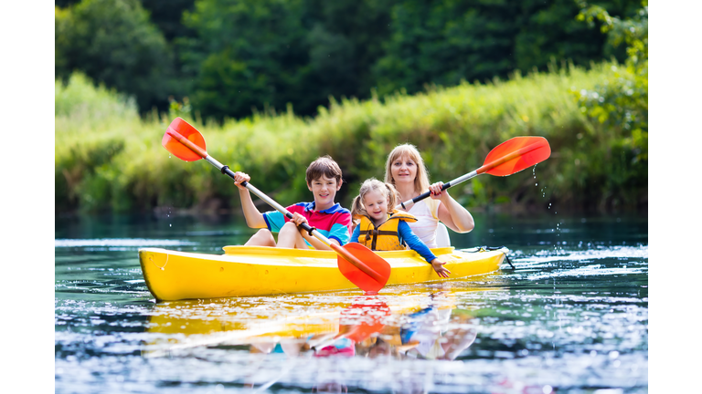 Family enjoying kayak ride on a river