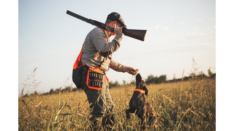 Hunter with hunting dog during a hunt