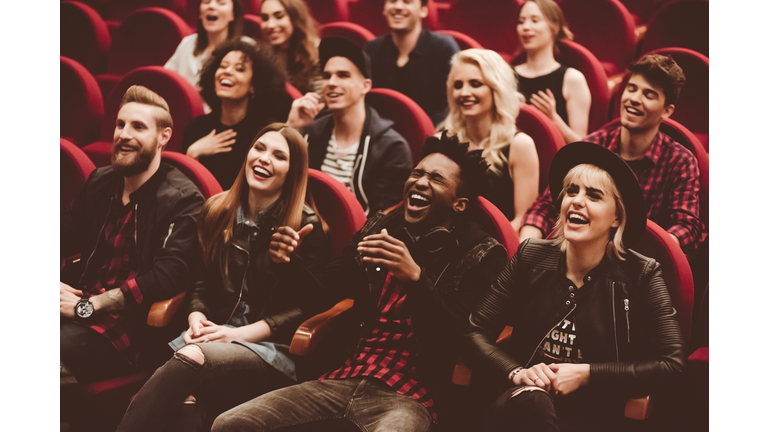 Multi ethnic group of people in the movie theater