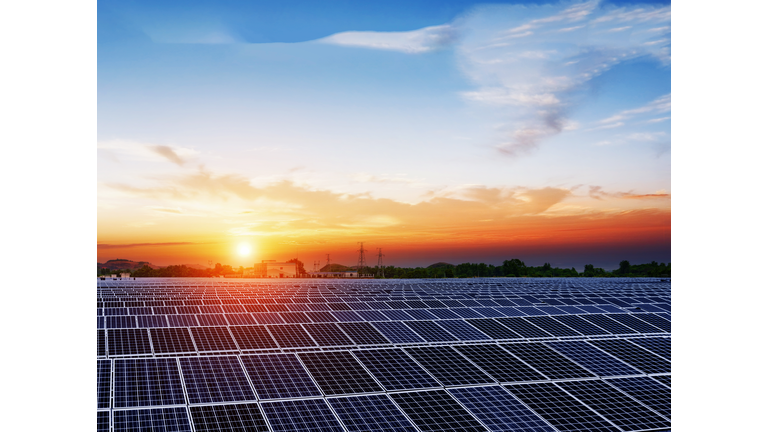solar panels  under blue sky on sunset