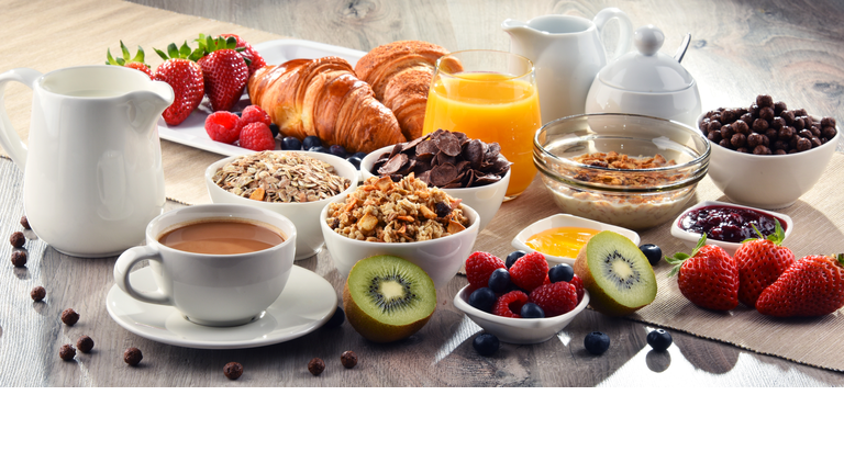 Breakfast served with coffee, juice, croissants and fruits