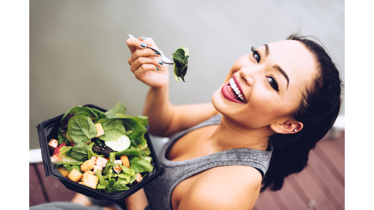 healthy woman eating the salad