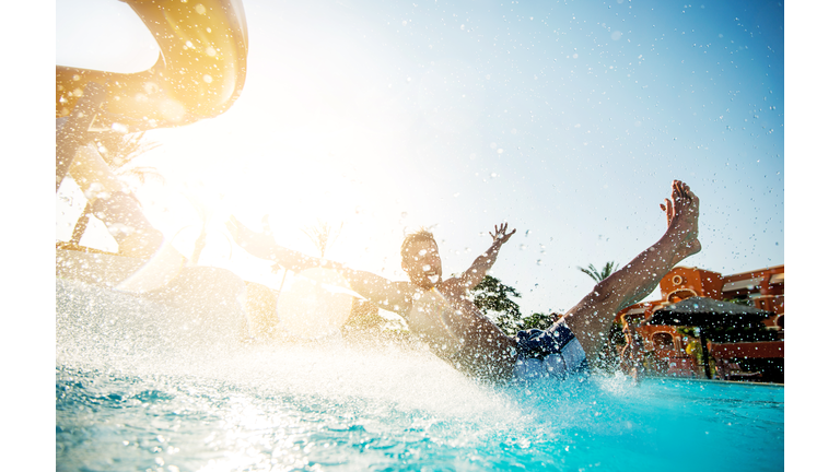 Man having fun on water slide.