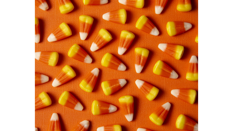 Halloween Candy Corn Background on an Orange Surface