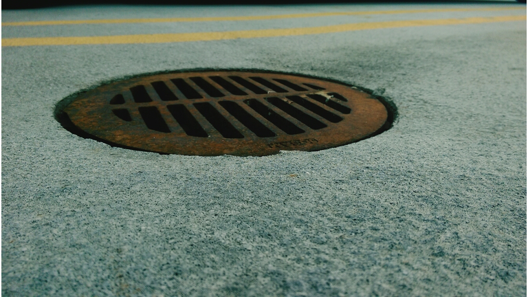 Close-Up Of Sewer On Street