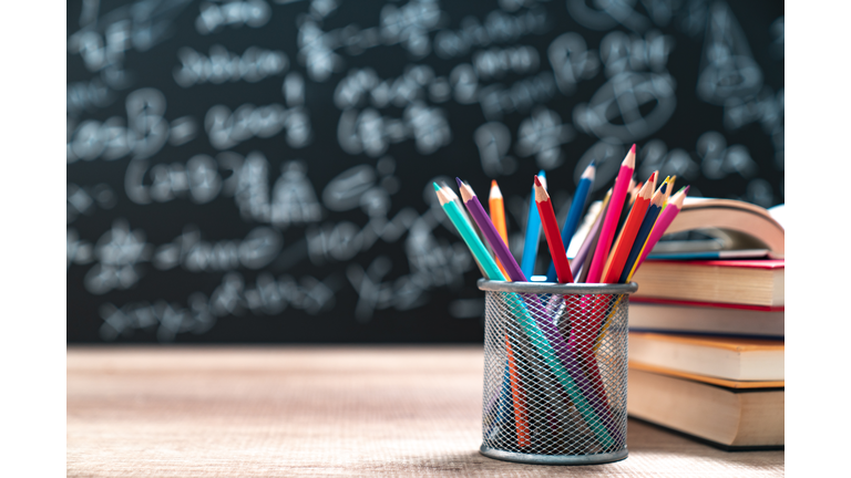 School books on desk, education concept