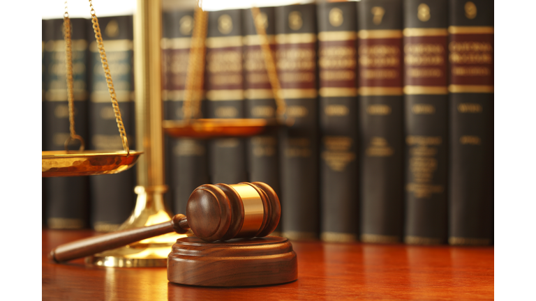 Gavel And Scales Of Justice On Desk In Law Office