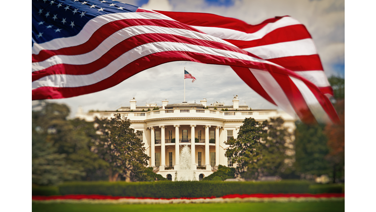 The White House with waving American flag