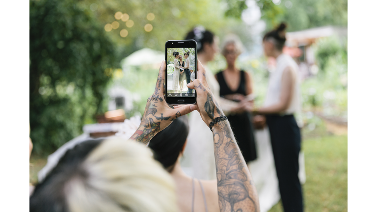 Woman taking photo at Wedding