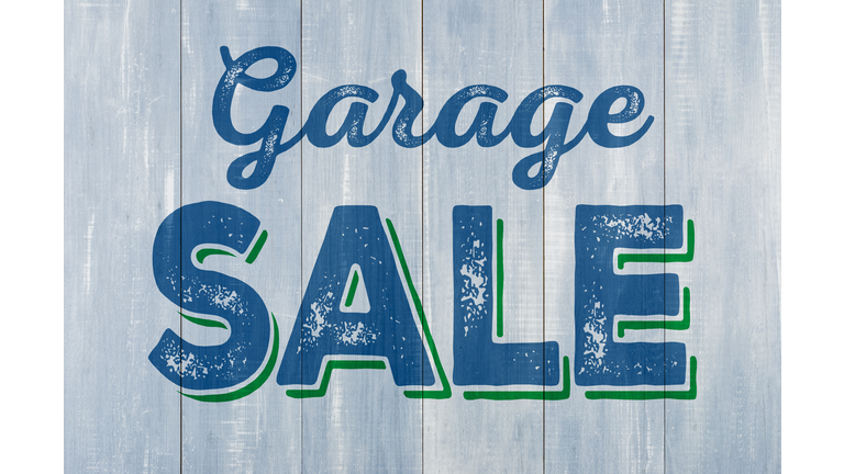 Blue wooden wall with the inscription Garage Sale