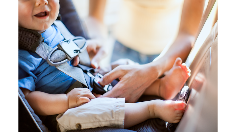 Baby and Mother Strapping in Carseat