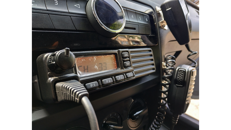 Police patrol car radio equipment and microphone. Walkie-talkie. Selective focus.